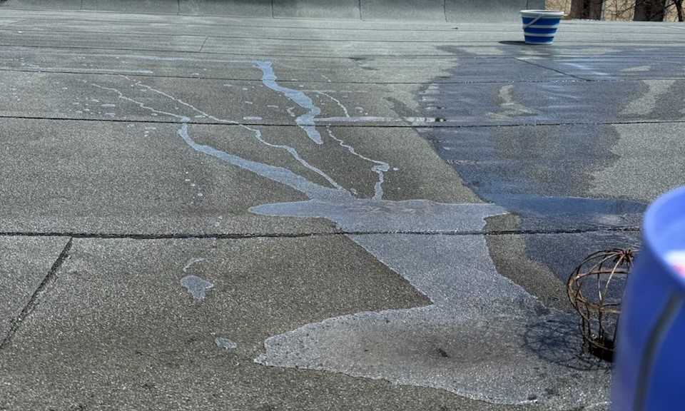 Commercial flat surface showing treated and untreated areas during water protection demonstration