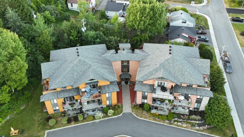 Before GoNano NuRoof Revive™ treatment on a multi-family roof